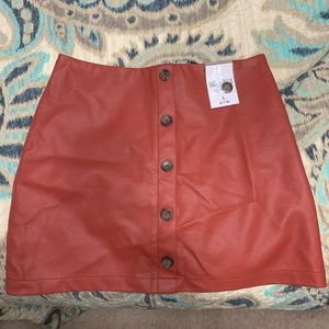 Burnt red pleather mini skirt. Size L.